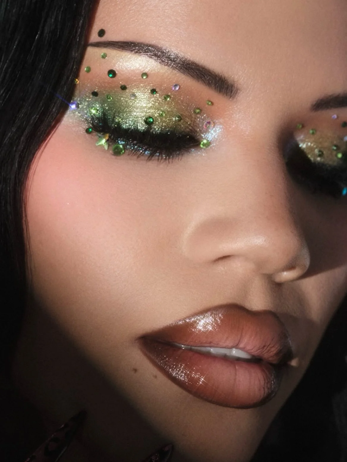 dark sparkly vibes on gorg @luvmecamille ✨ Using all @anastasiabeverlyhills hair by @georgecozmahair assisted by @ghost_artistry_ #makeupinspo #rhinestonemakeup #creativemakeup